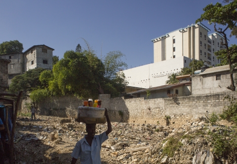 The Best Western Premier rises seven stories above a ravine used as a garbage dump in Pétion-Ville.