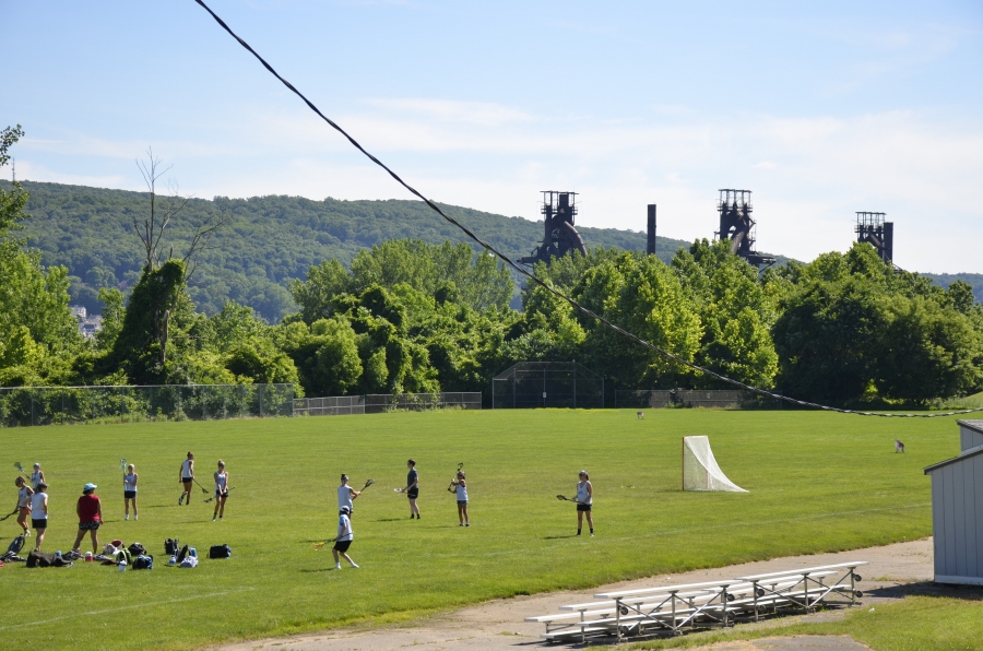 Lacrosse players in the shadow of the old Bethlehem Steel mill. 